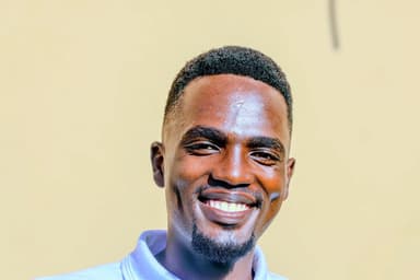 Portrait of Emmanuel Kamau, Policy Coordinator at Beyond Borders – For Her